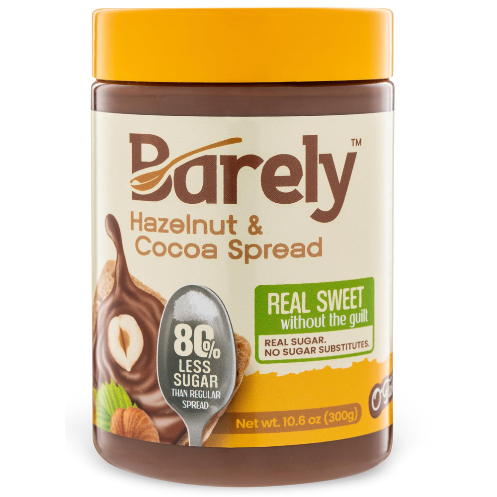 Barely Hazelnut & Cocoa Spread bottle pour showing rich flavor with reduced sugar.