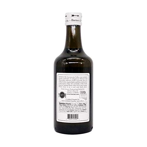 Bariani Extra Virgin Olive Oil on a rustic table highlighting authentic California origin and craft.