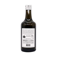Bariani Extra Virgin Olive Oil on a rustic table highlighting authentic California origin and craft.