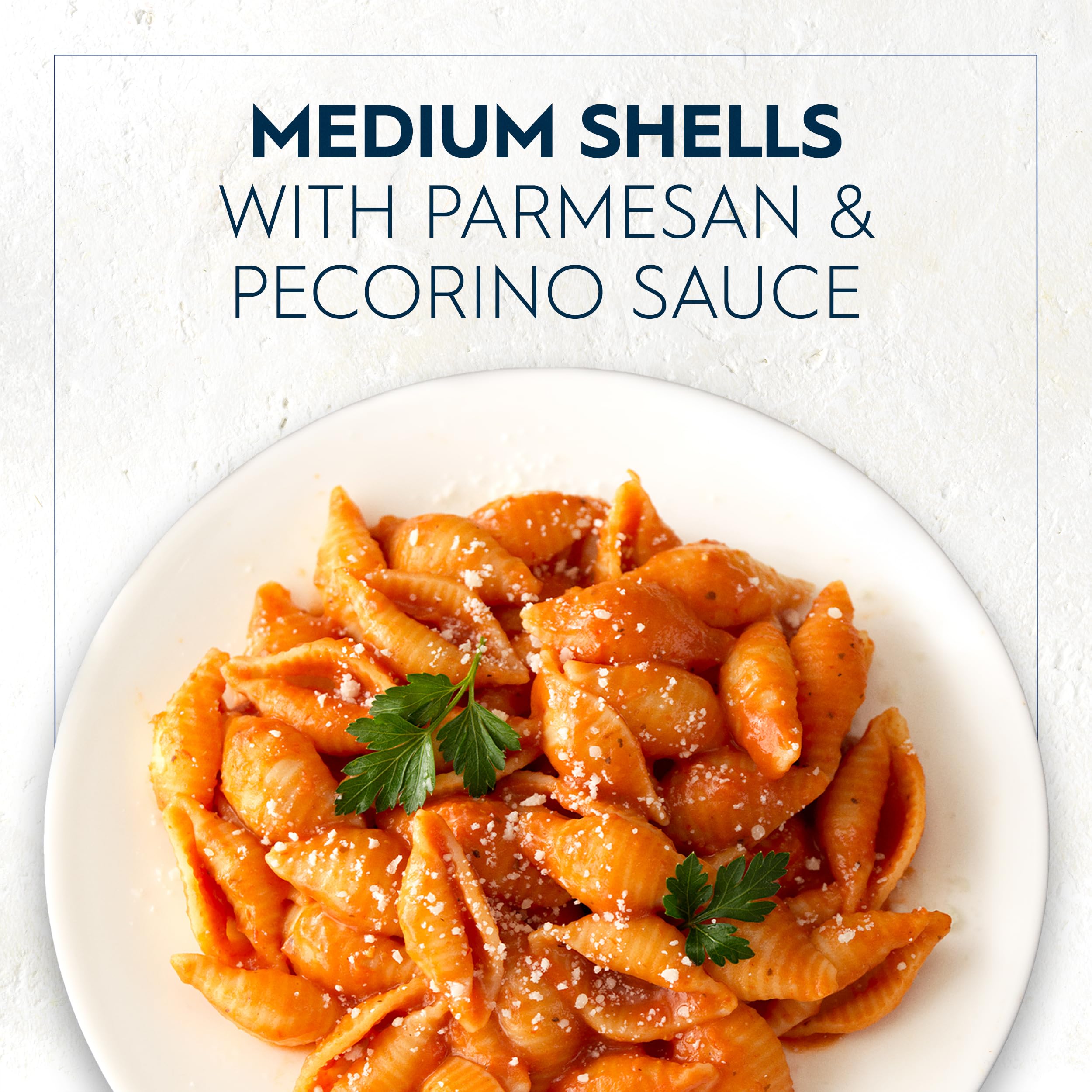 Barilla Medium Shells boiling in water for al dente texture