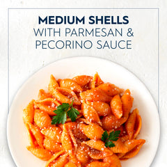 Barilla Medium Shells boiling in water for al dente texture