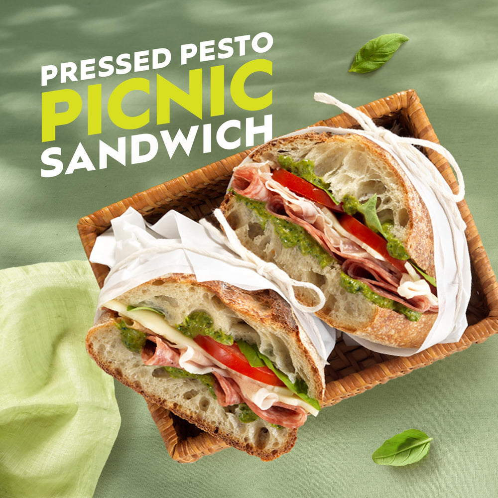 Pesto spread on a sandwich for a tasty flavor boost.