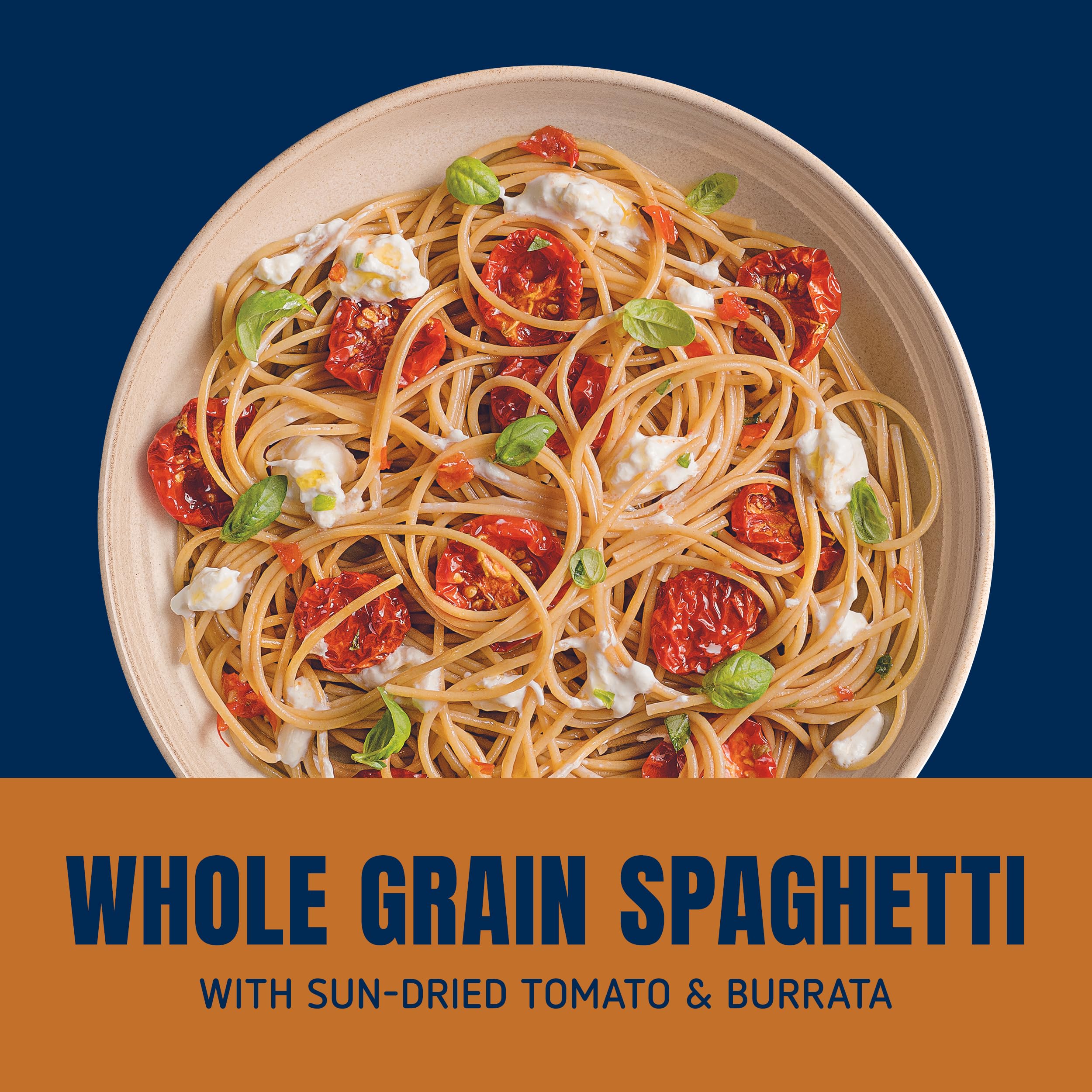 Barilla Whole Grain Spaghetti plated with vegetables and sauce for a complete meal
