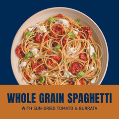Barilla Whole Grain Spaghetti plated with vegetables and sauce for a complete meal