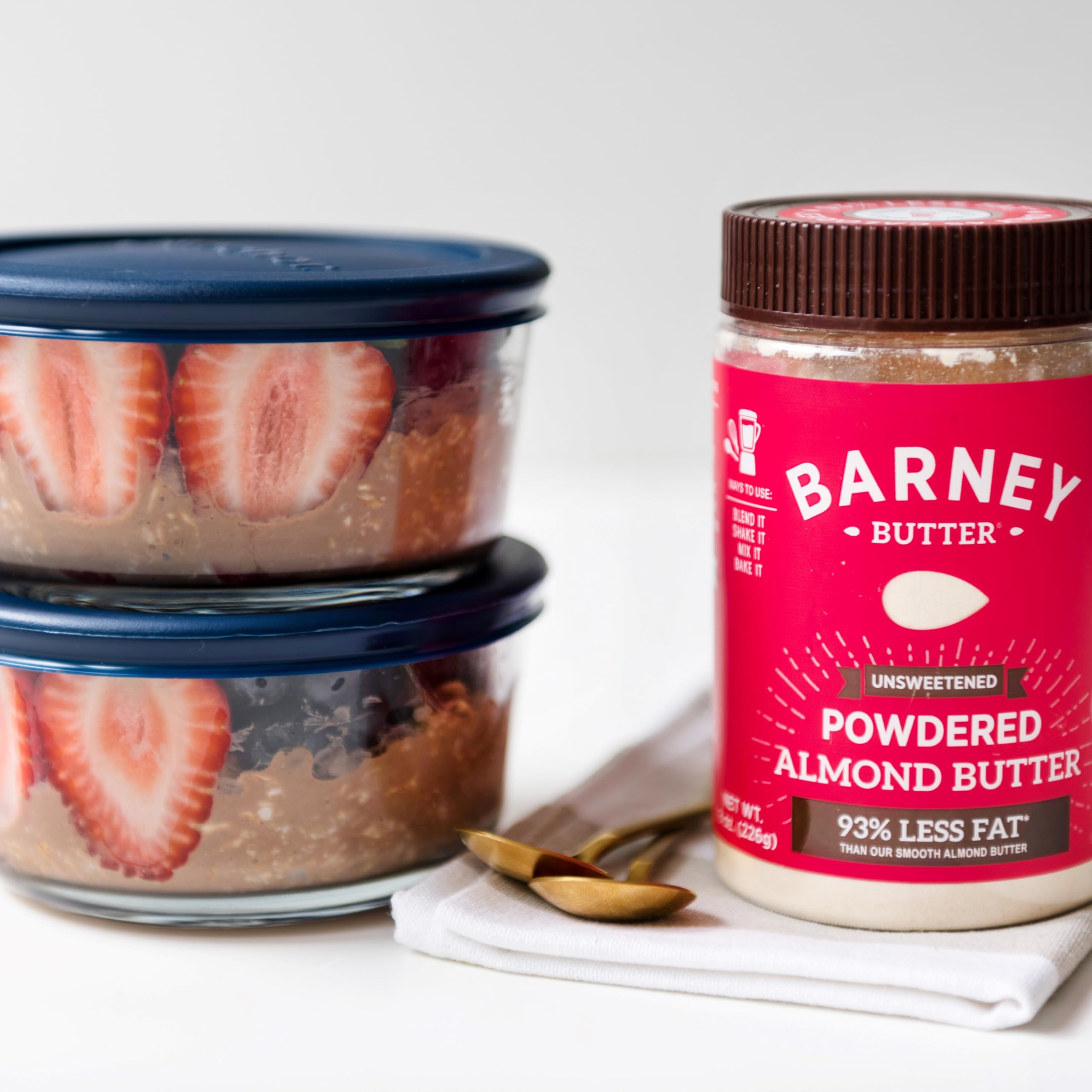 Barney Butter Powdered Almond Butter powder scoop in bowl for quick protein boost.