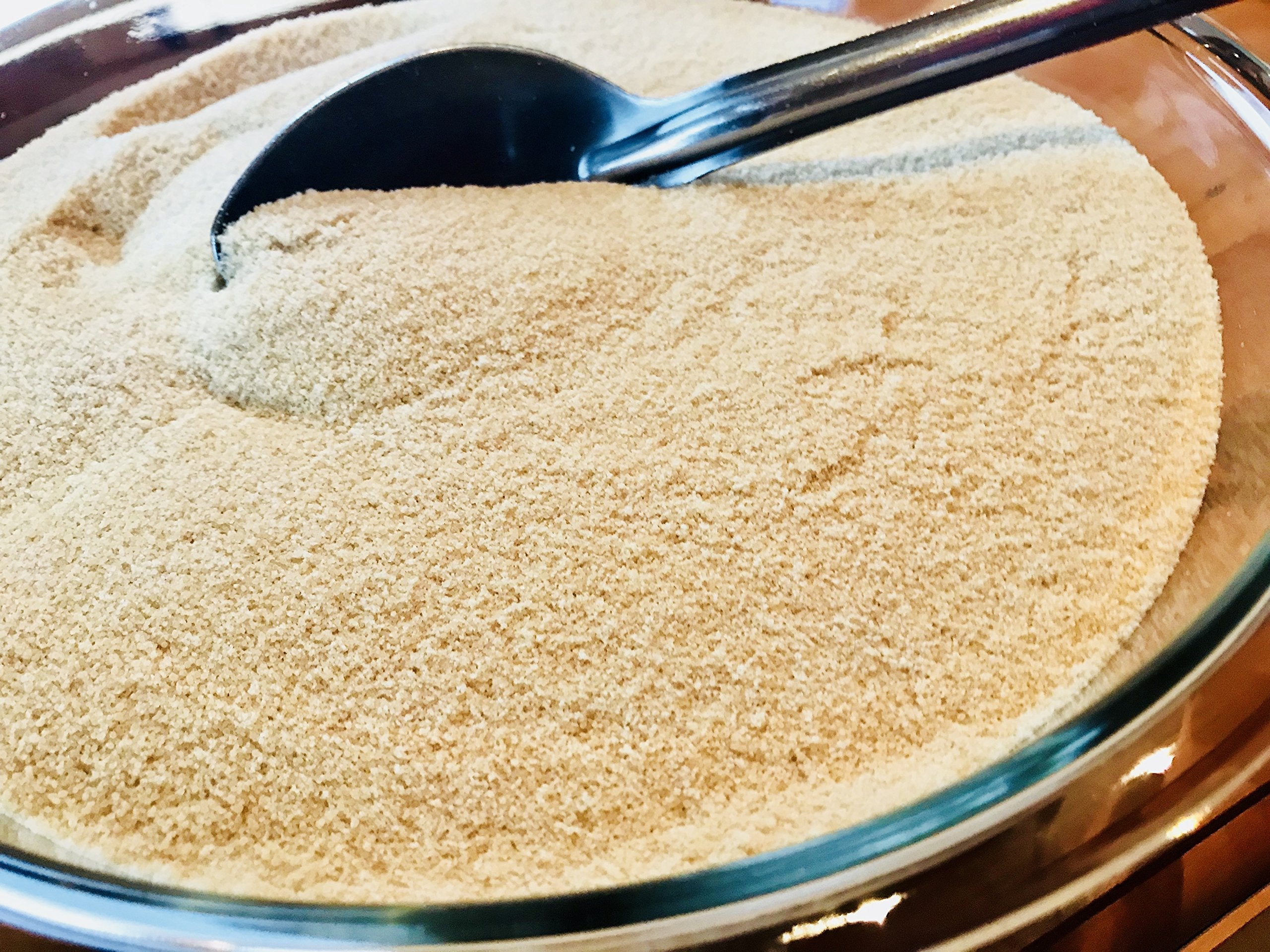 Barred Woods maple sugar being poured, showcasing versatile use in coffee and tea