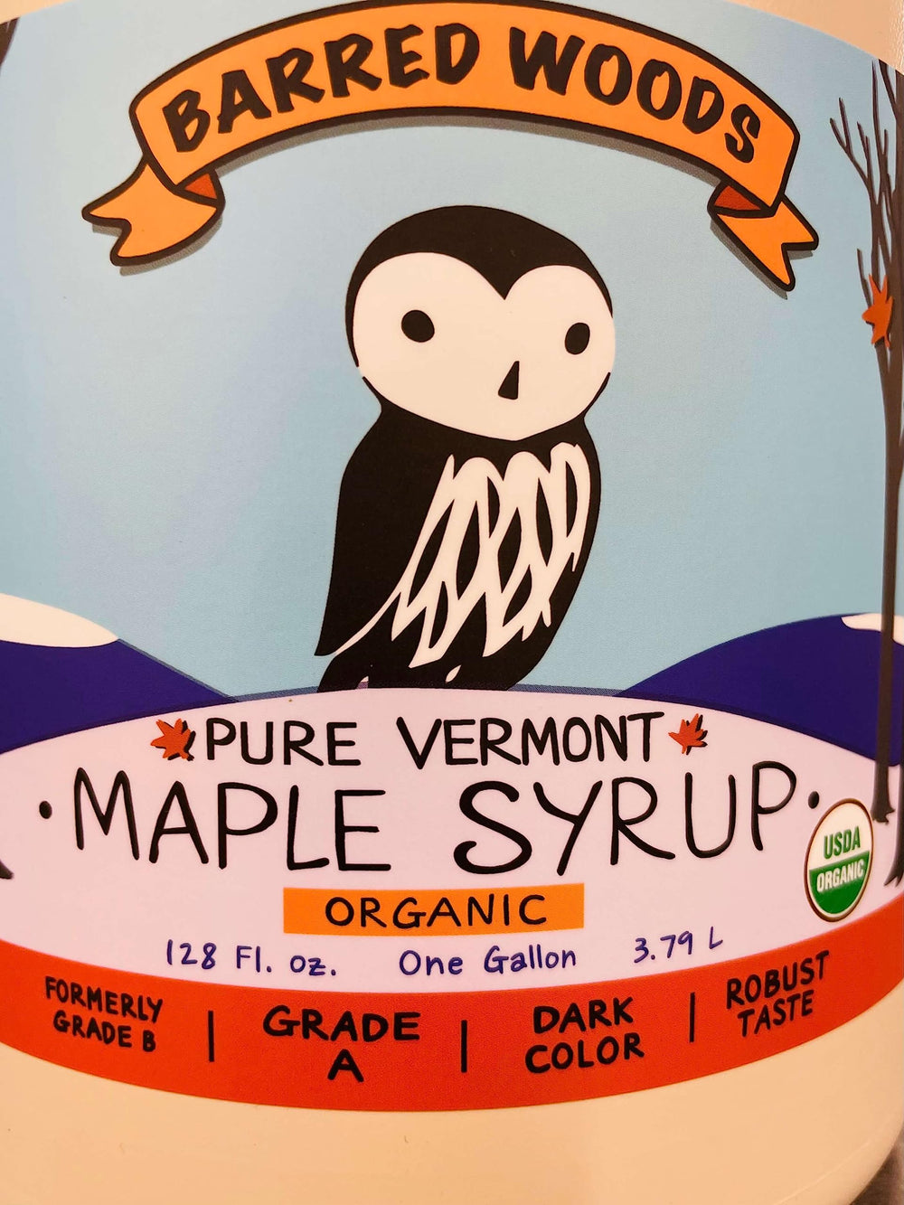 Barred Woods maple syrup bottle pour shows smooth drizzle ideal for breakfast