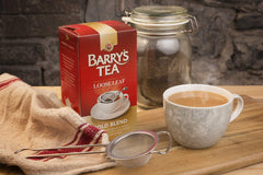 Barry's Gold Blend tea brew showcasing a vibrant golden color and smooth finish.