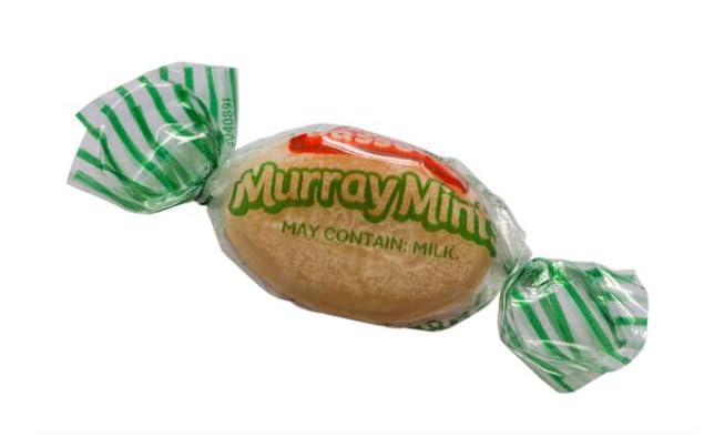 Murray Mints beside tea, ideal for a comforting pairing.
