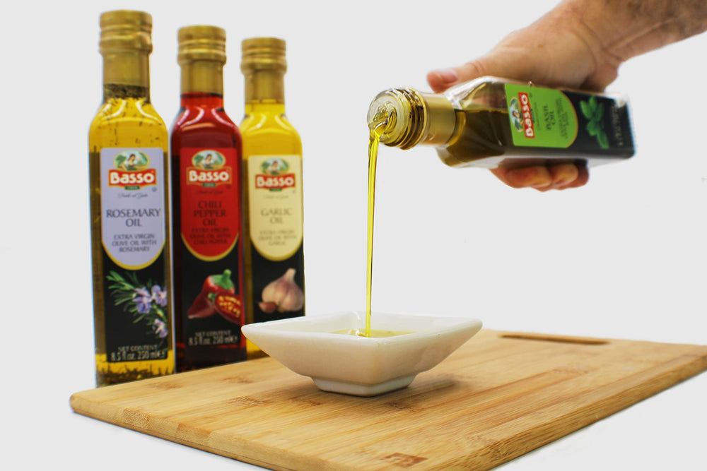 Basso 1904 chili pepper-infused oil bottle on caprese-style salad.