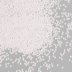 Bayep white edible pearls 2mm bottle adds a refined finishing touch to elegant desserts.