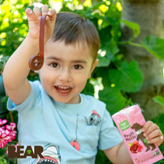Kids enjoying BEAR Raspberry Snack Rolls as a no-added-sugar treat.