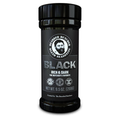 Bearded Butcher Black Blend jar close-up, rich color and natural ingredients for robust grilling.