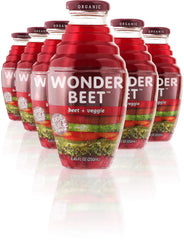 Beetology bottle pouring beet juice for a refreshing wellness moment.