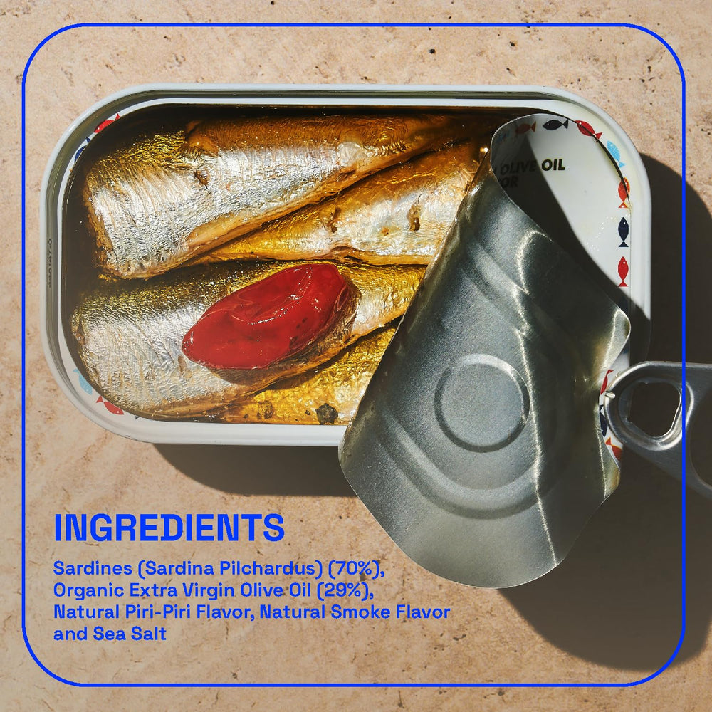 BELA Portuguese sardines served on a plate with herbs, ready to pair with bread.