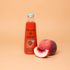 Bellini Cipriani mix over ice creates a crisp fruity aperitif.