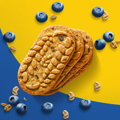Yogurt and Belvita blueberry biscuits on a plate, pairing for a balanced start.
