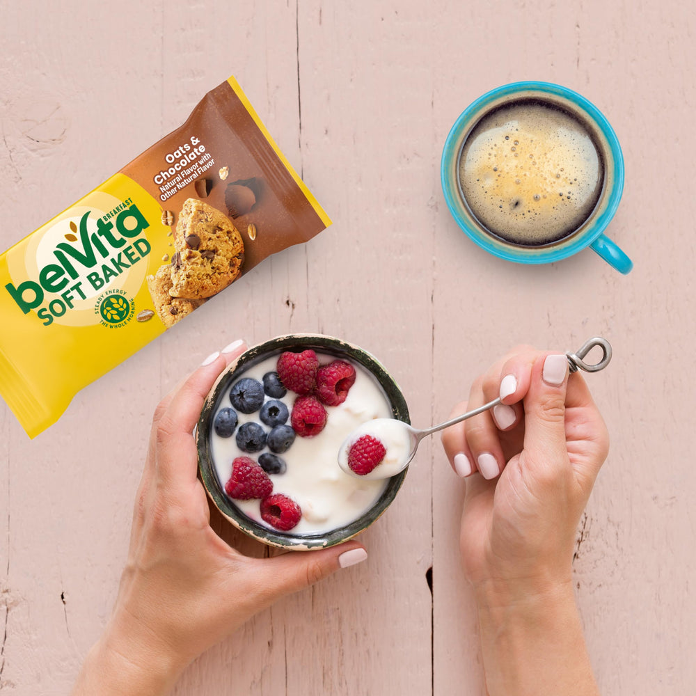 Belvita bar served with yogurt and fruit for a balanced breakfast.