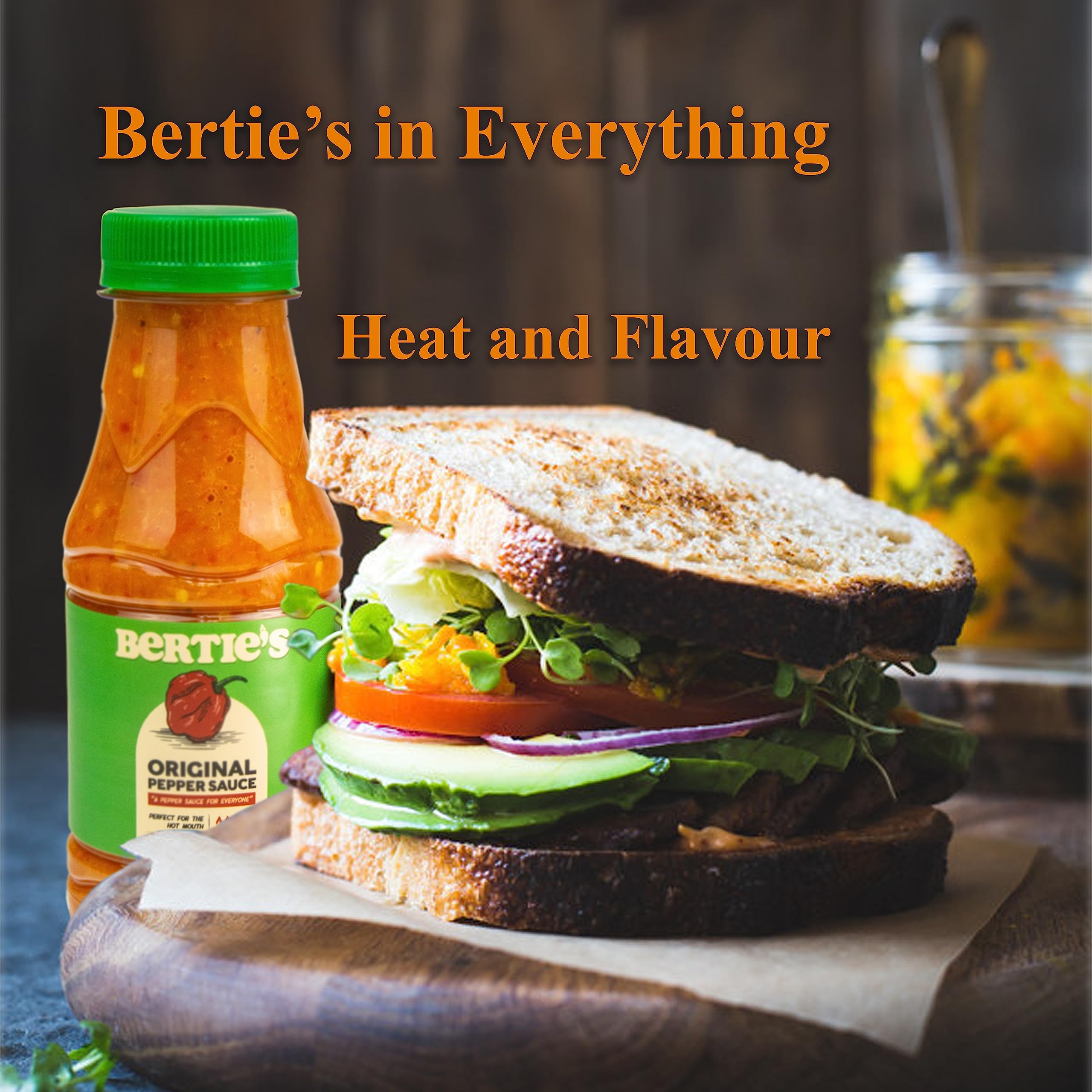 Bertie's Original Pepper Sauce being brushed on grilled meat as a glaze.