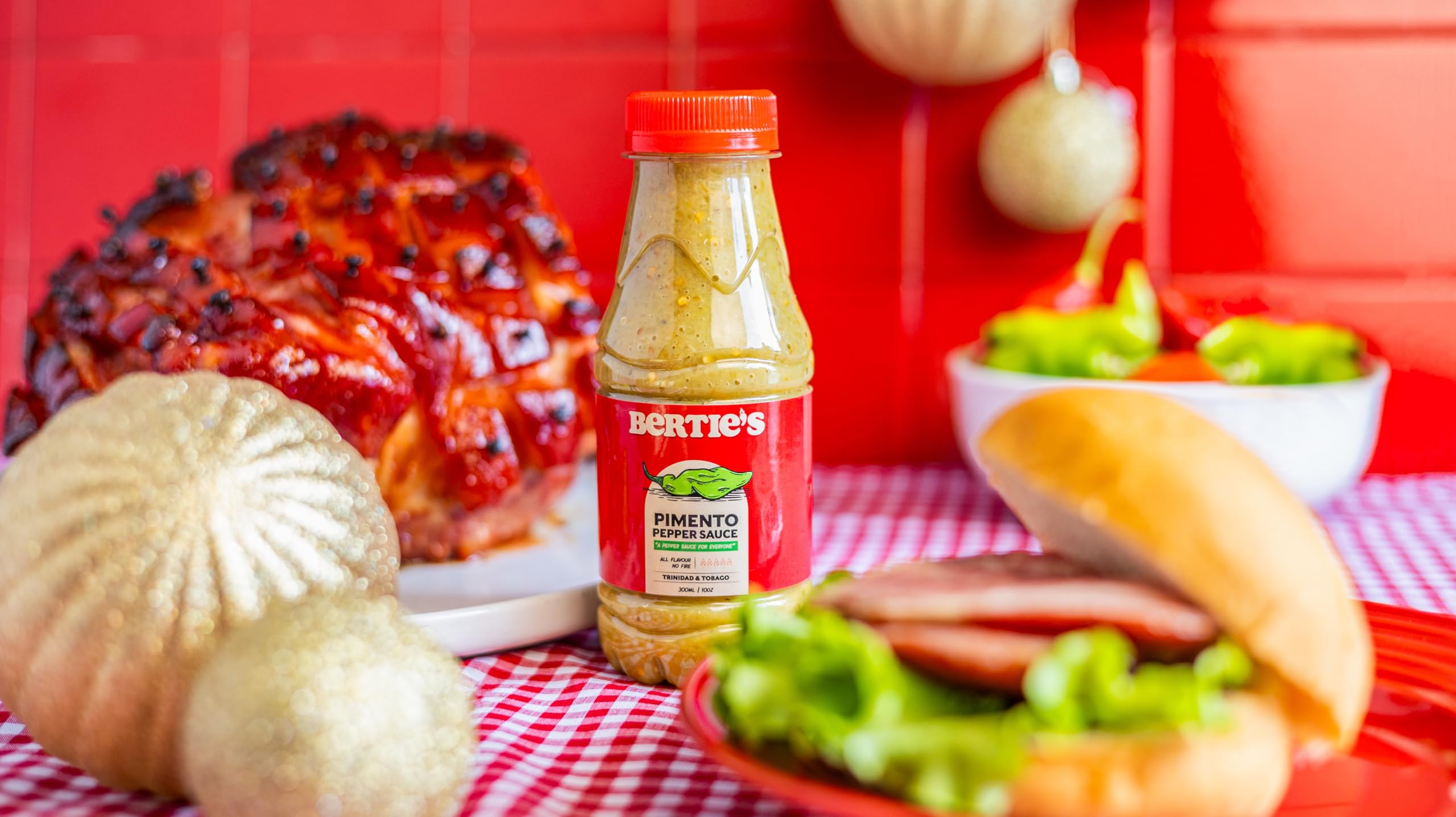 Berties Trinidad Pimento Sauce label close-up shows fresh peppers for marinades