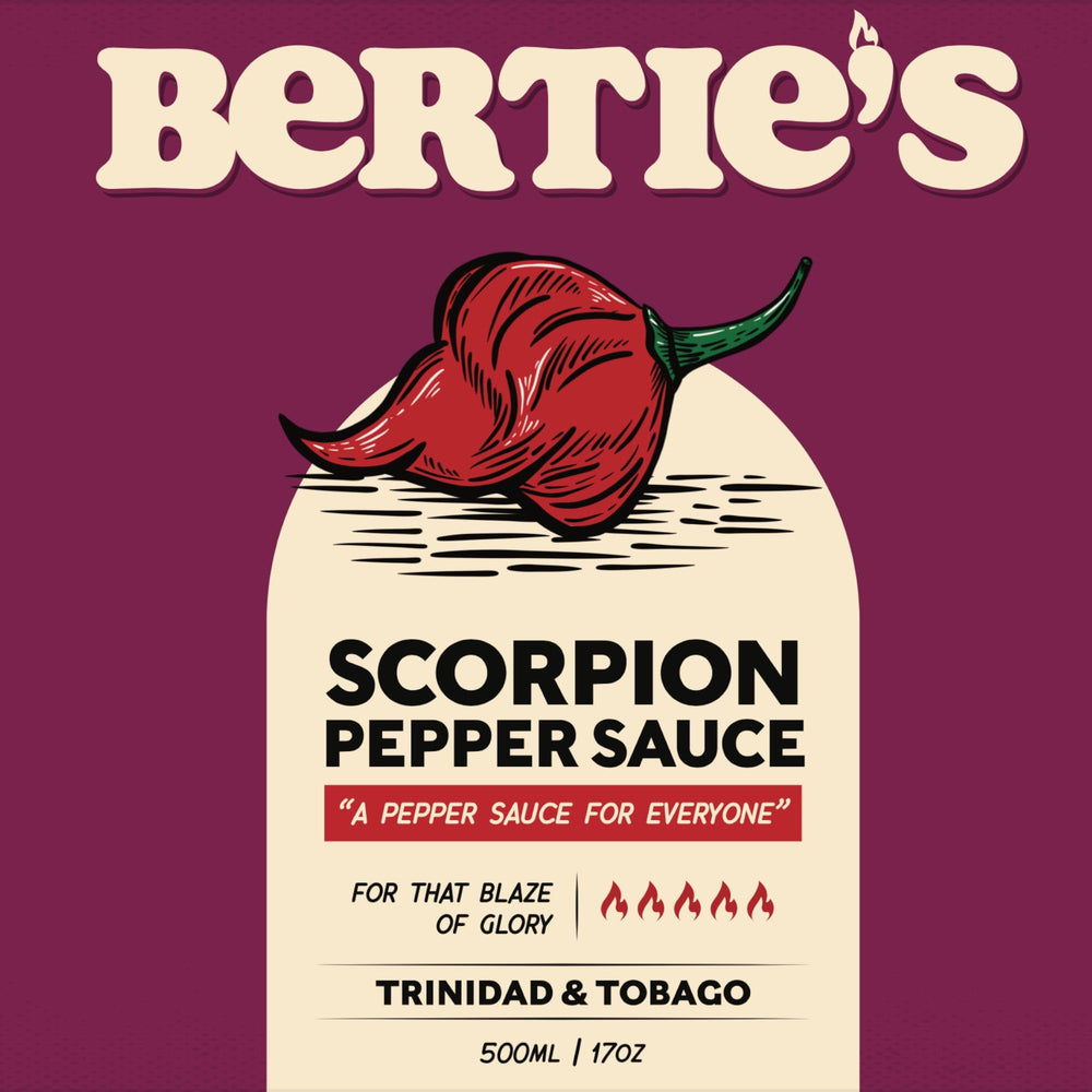 Bertie's Trinidad Scorpion Pepper Sauce on plate beside curry and rice for flavor boost.