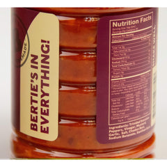 Bertie's Trinidad Scorpion Pepper Sauce pour shot showing intense aroma and heat release.