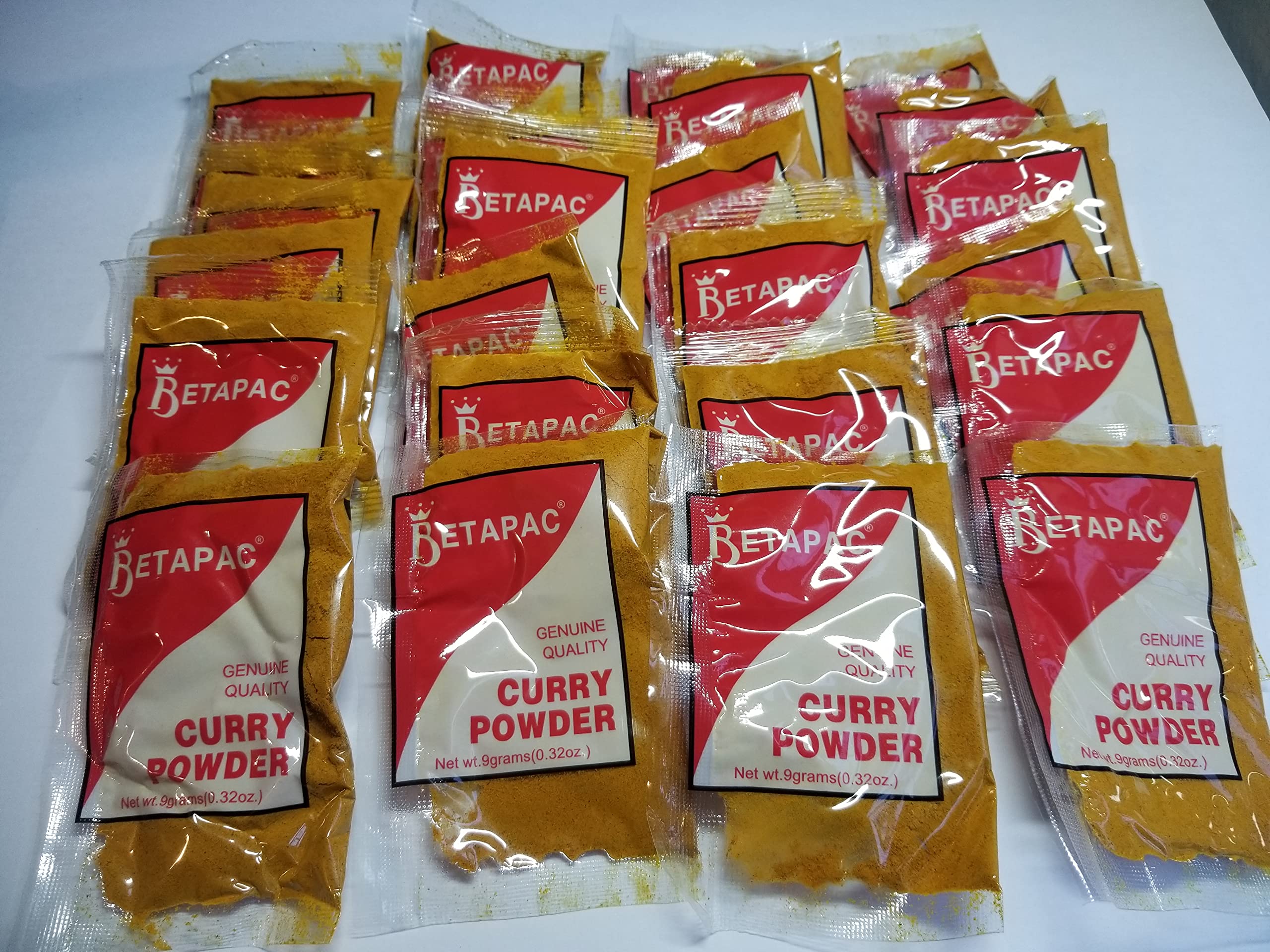 Betapac curry powder on a kitchen counter, ready to season Caribbean-inspired dishes.