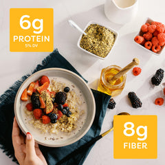 Pouring BetterBody Foods Super Seeds into a smoothie for texture.