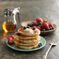 Golden waffles plated with syrup using Betty Crocker mix