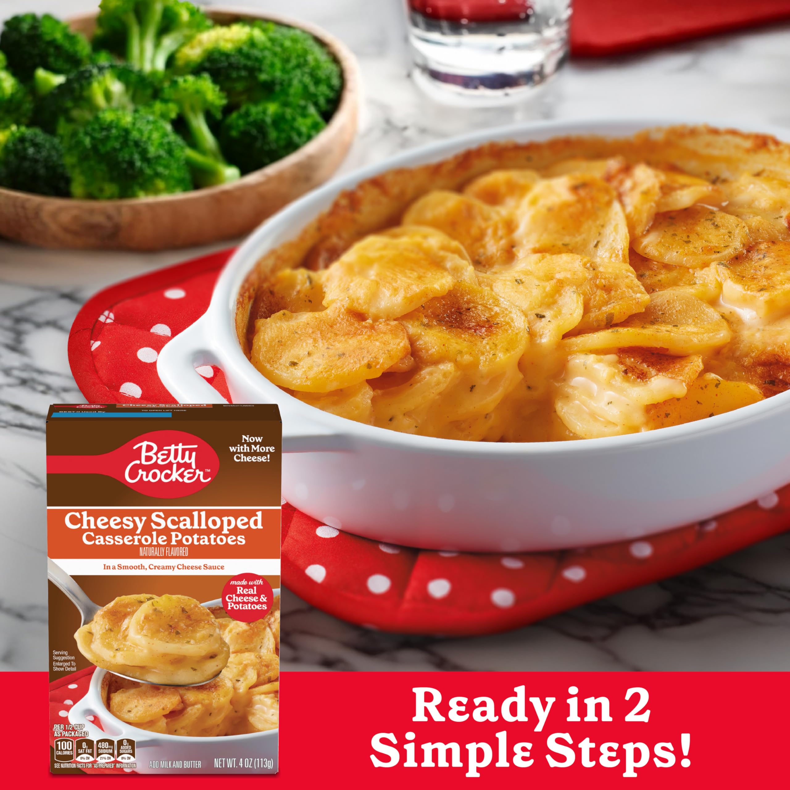 Betty Crocker Cheesy Scalloped Potatoes in cooking pot, simmering.