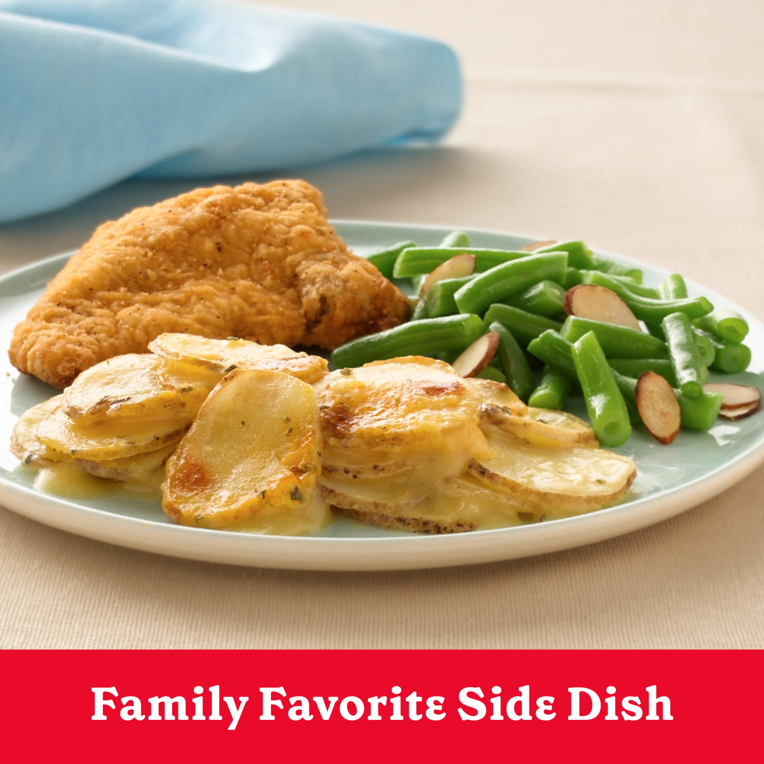Betty Crocker Cheesy Scalloped Potatoes served in bowl, comforting dinner.