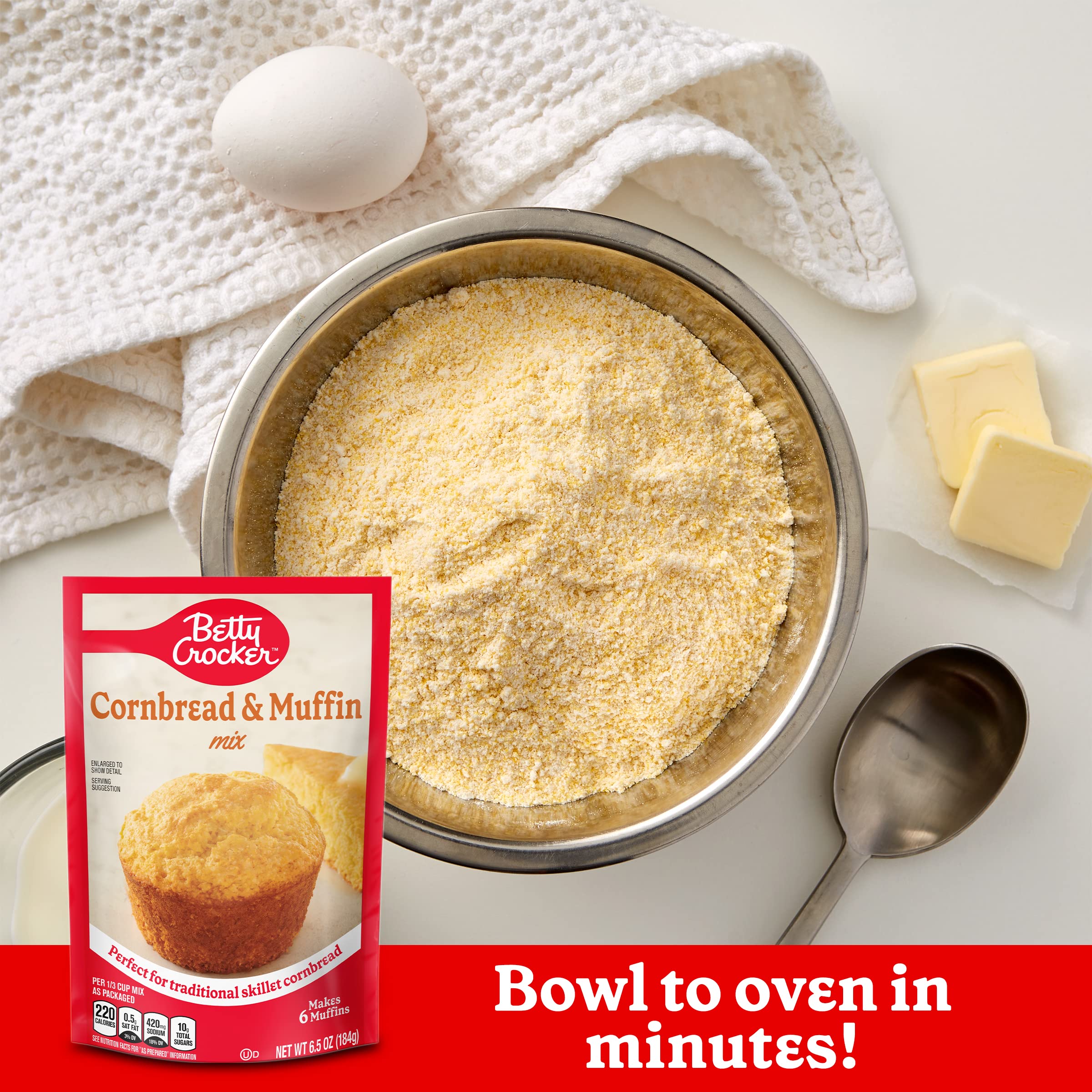 Pouring Betty Crocker batter into a muffin tin for quick baking