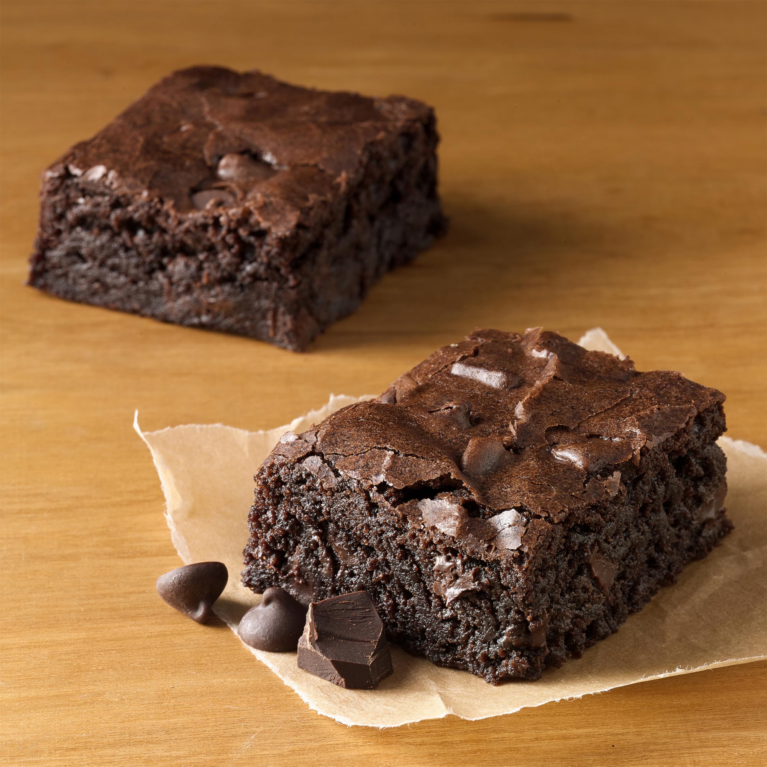 Betty Crocker Delights Supreme Chocolate Chunk Brownie Mix bowl with dry mix and ingredients laid out
