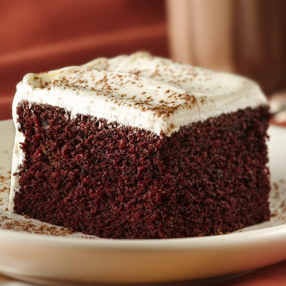 Frosting spread on cake using Betty Crocker for quick indulgence.