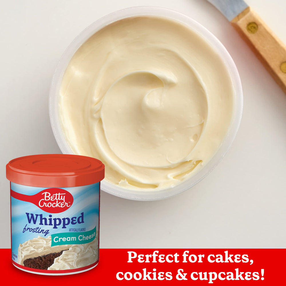 Swirled Betty Crocker frosting on cupcakes with decorative sprinkles.