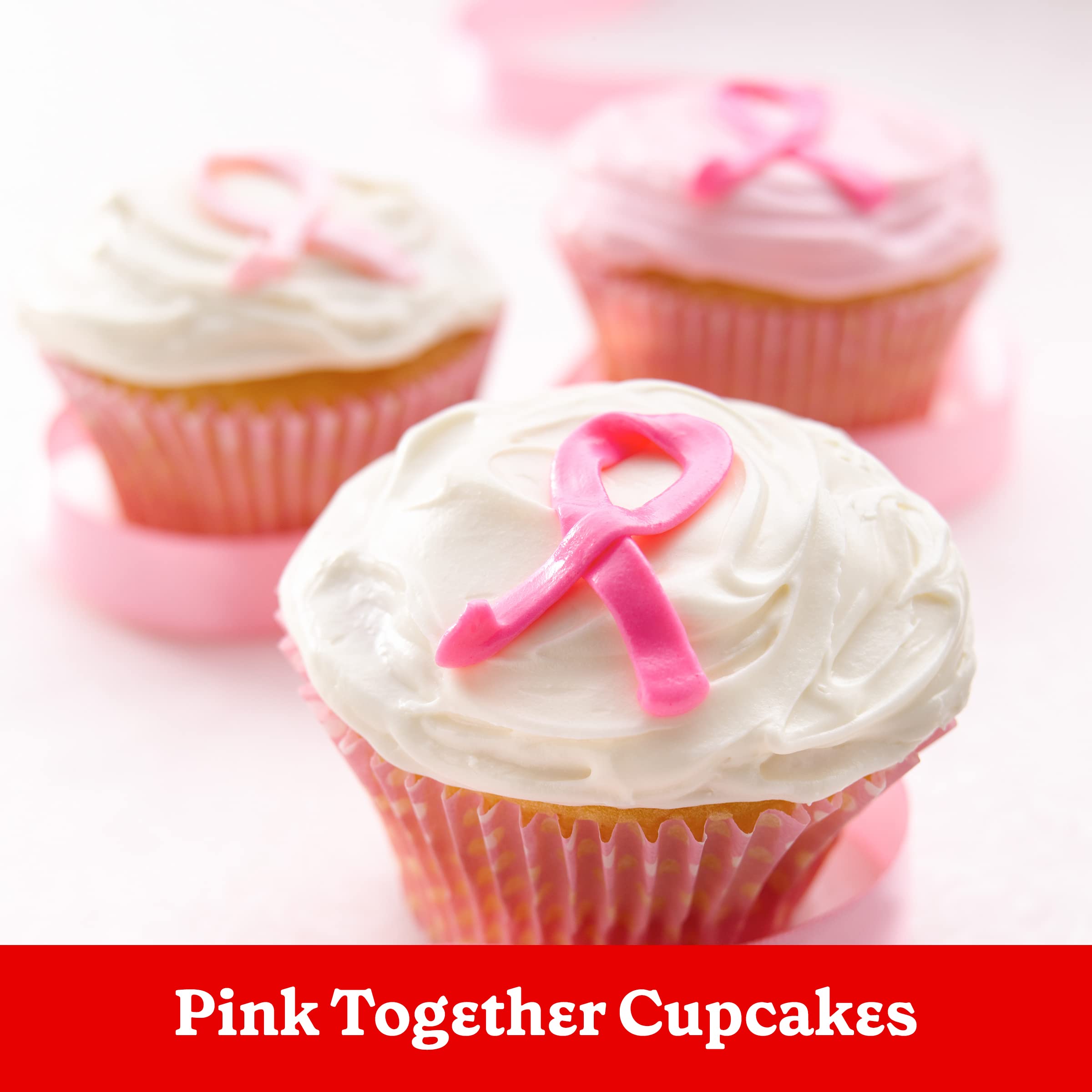 Frosting with sprinkles on a festive Betty Crocker dessert.