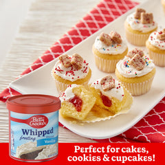 Betty Crocker Gluten Free Whipped Vanilla Frosting decorates cookies with shine.