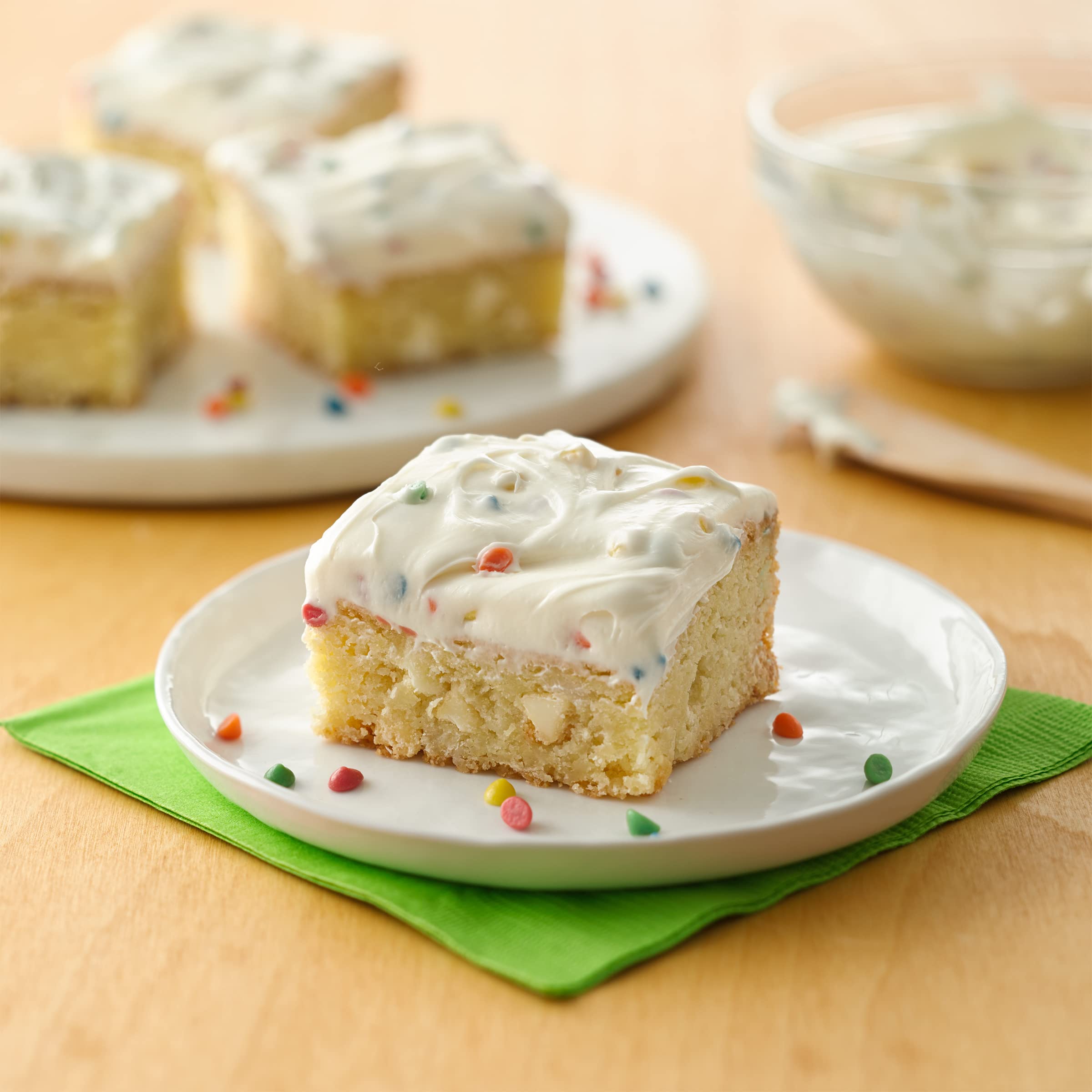Betty Crocker Rainbow Chip Frosting jar spread for quick, creamy topping on cupcakes.