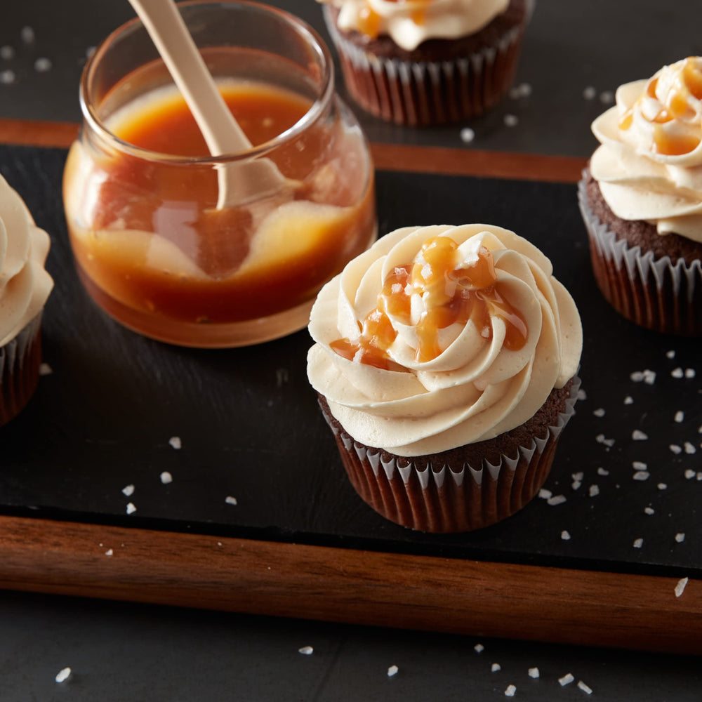 Betty Crocker Whipped Butter Cream Frosting spread on cake; easy decoration and coverage.