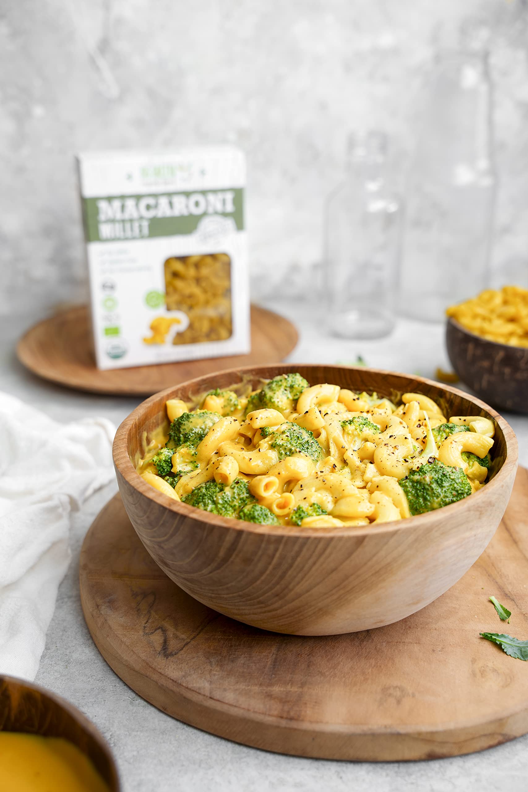 Cooked millet macaroni elbows served, ideal with tomato sauce or pesto.