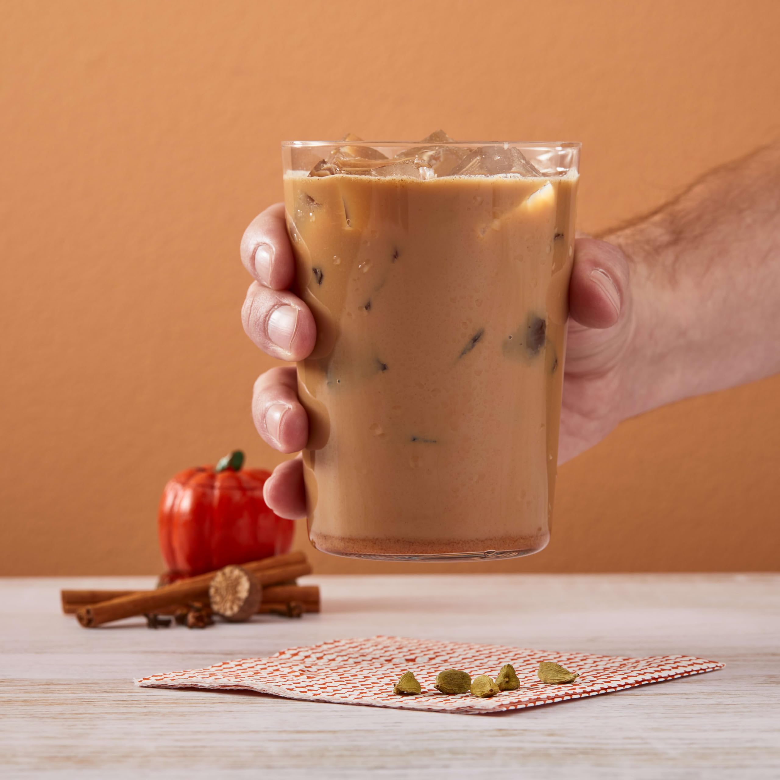 Big Train Pumpkin Pie Chai iced latte being poured into a glass