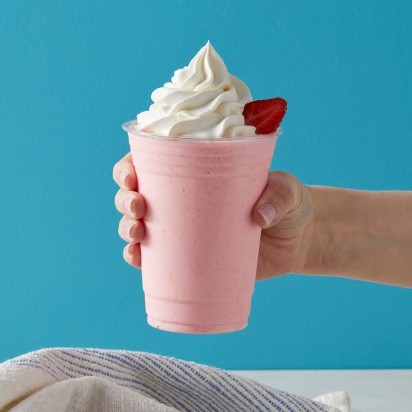Glass of strawberry frappé highlighting creamy texture and aroma.