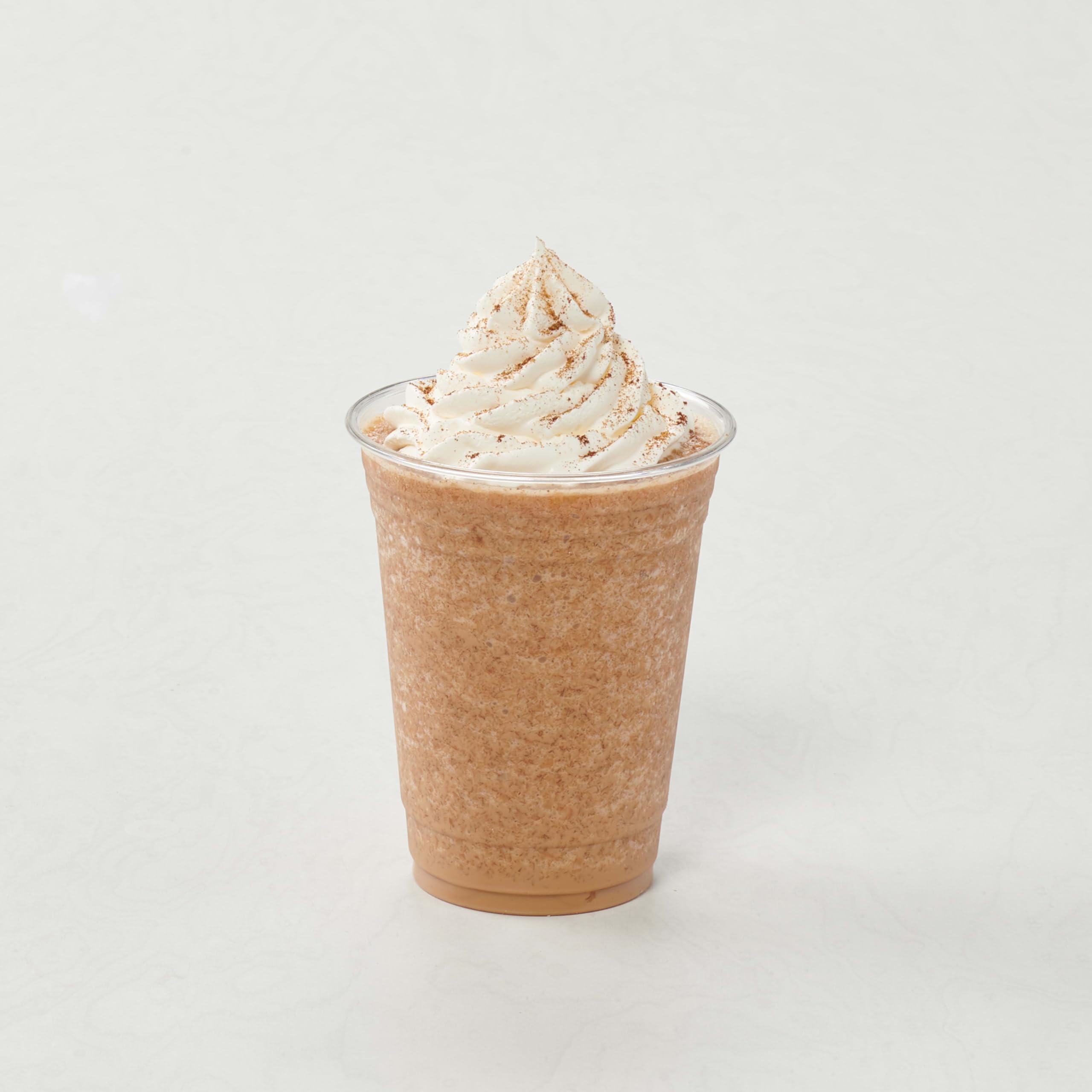 Cafe counter with Big Train Vanilla Chai Latte mix ready to serve.