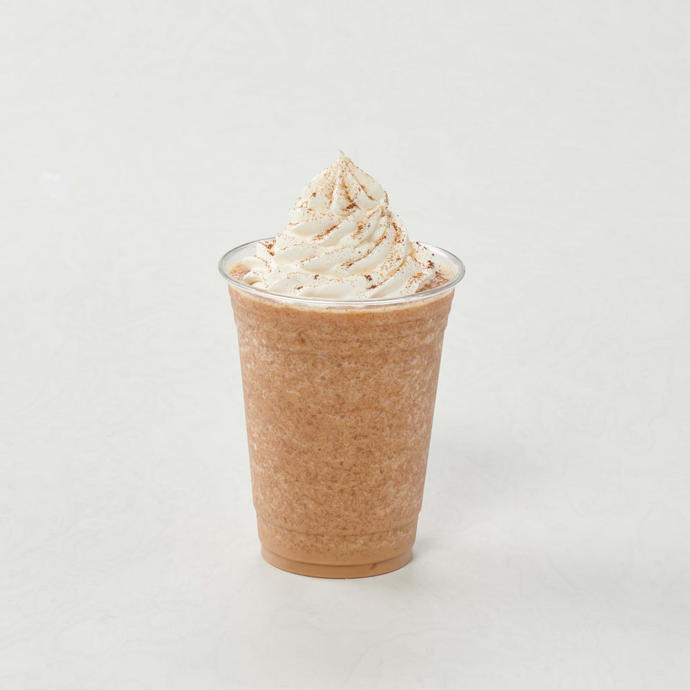Cafe counter with Big Train Vanilla Chai Latte mix ready to serve.