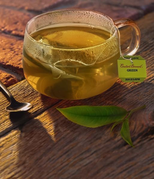 Bigelow Constant Comment Green Tea in a glass cup, smooth infusion for hot or iced enjoying.