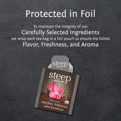Brewing a cup of Bigelow Rooibos Hibiscus tea with citrus notes in a warm cup.