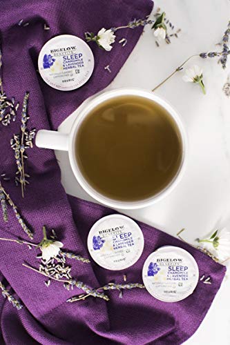 Bedside setup with Bigelow Tea box suggesting a relaxing nightly ritual.