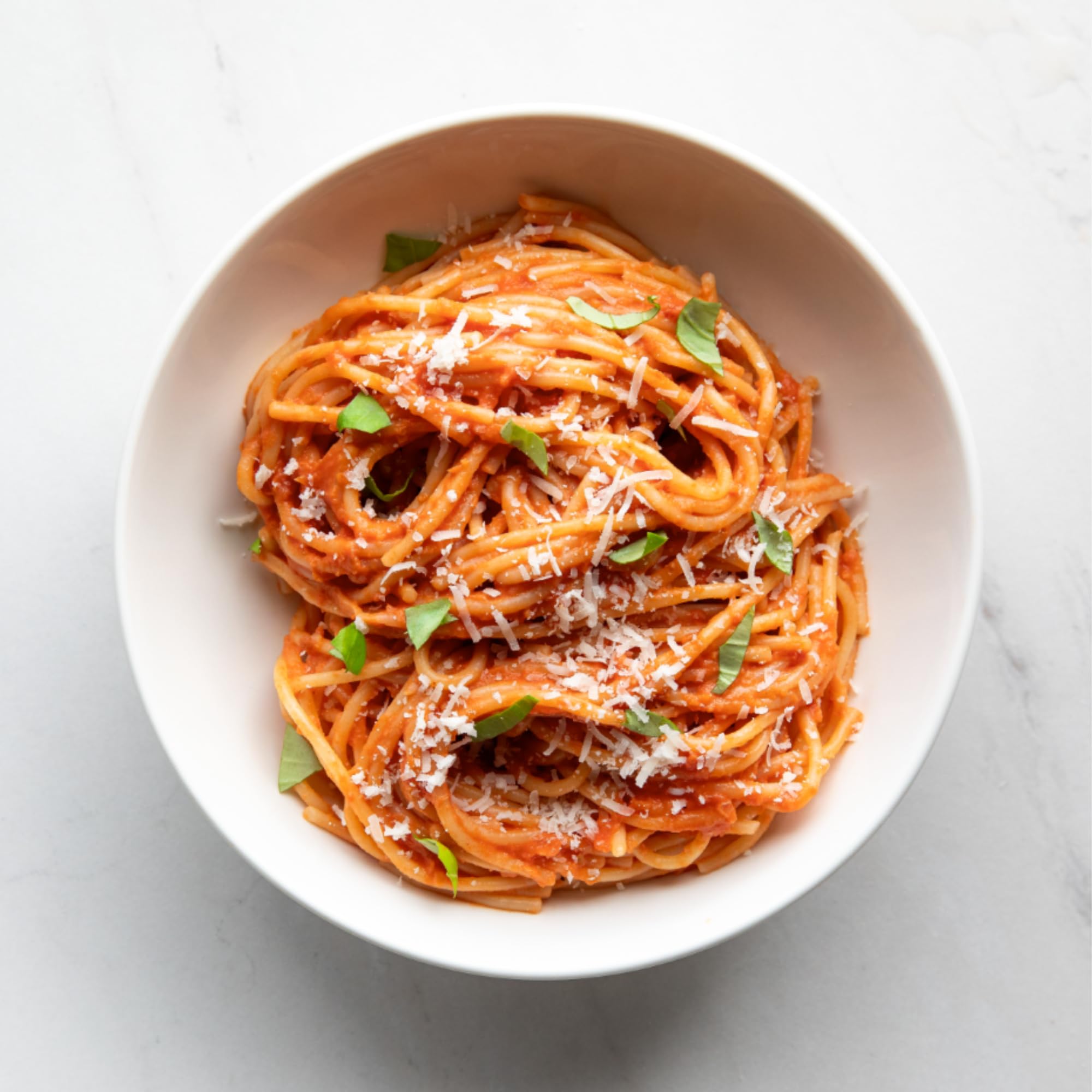 Family dinner table featuring Bionaturae spaghetti evokes comforting Italian-inspired meals.