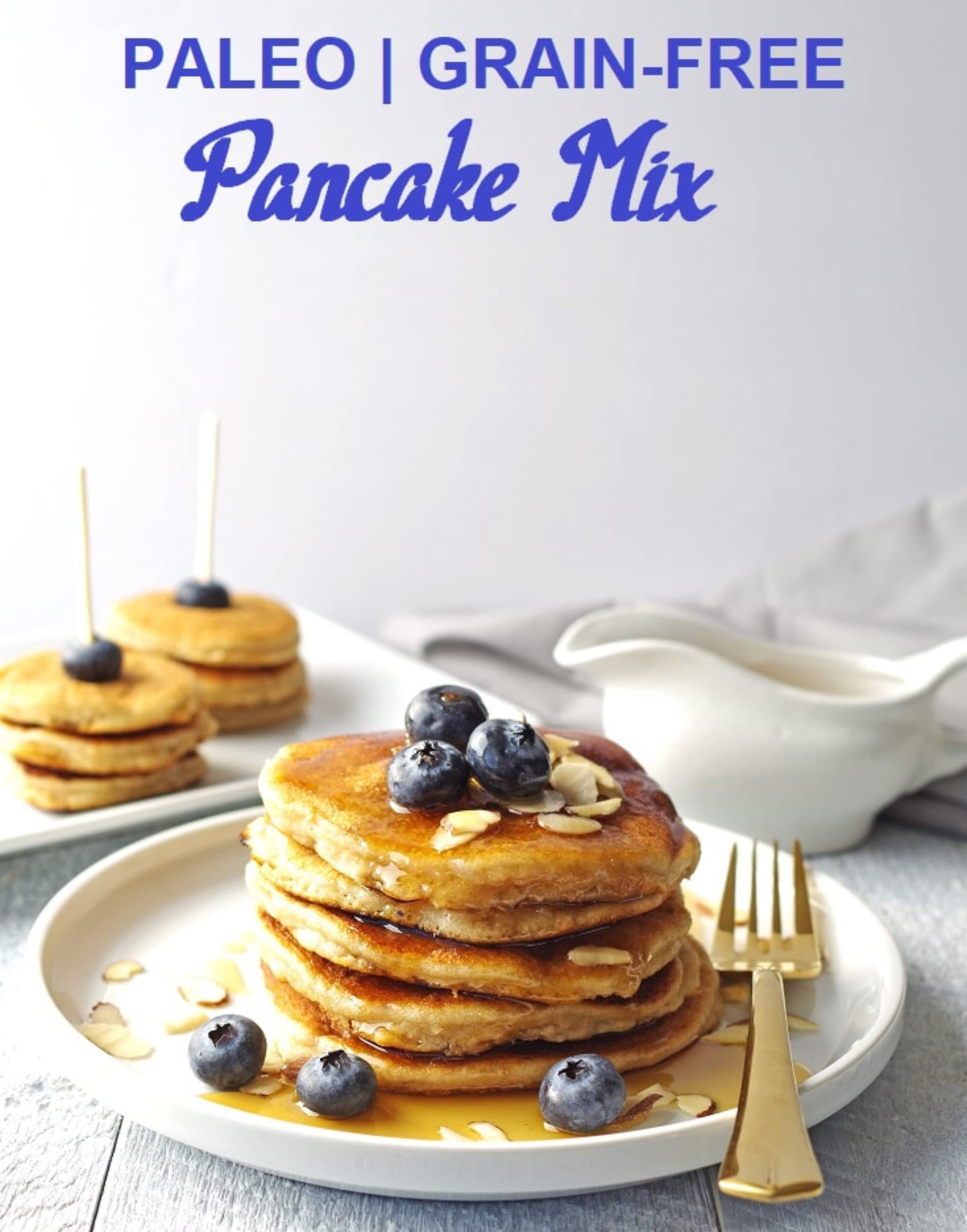 Pancakes and waffles turning golden on a hot griddle.