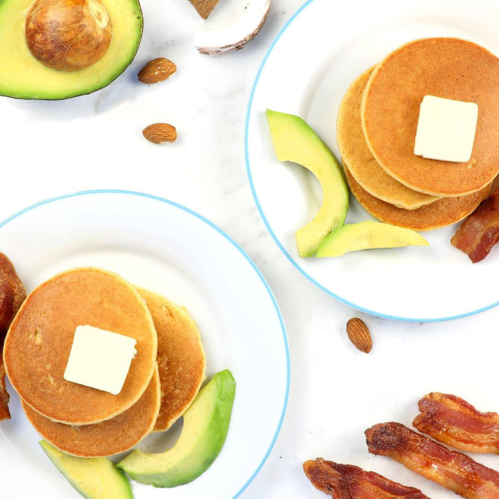 Birch Benders serving plate with pancakes and toppings.